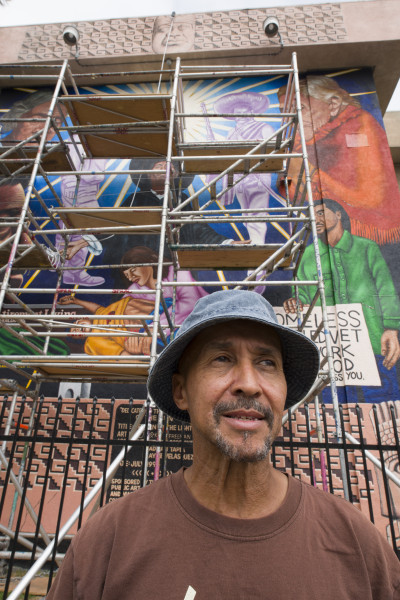 Charles "Boko" Freeman in front of his mural