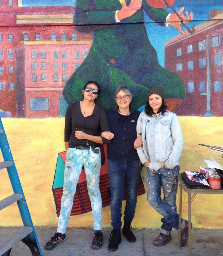 Christina Schlesinger posing with Citywide Mural Restoration Team members, Myisha and Ariel. 