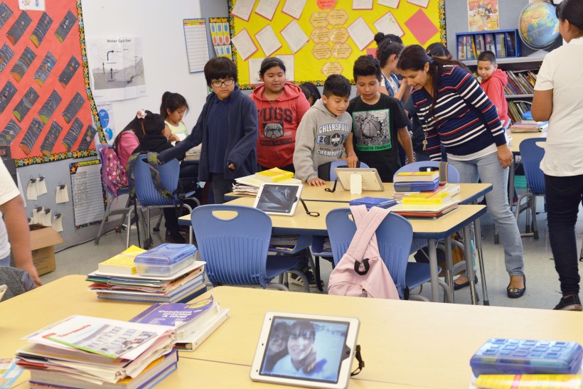 Ms. Dominguez’s 5th grade students during a gallery walk after a photography and photo-editing workshop on iPads led by Teaching Artist, Mary-Linn Hughes.